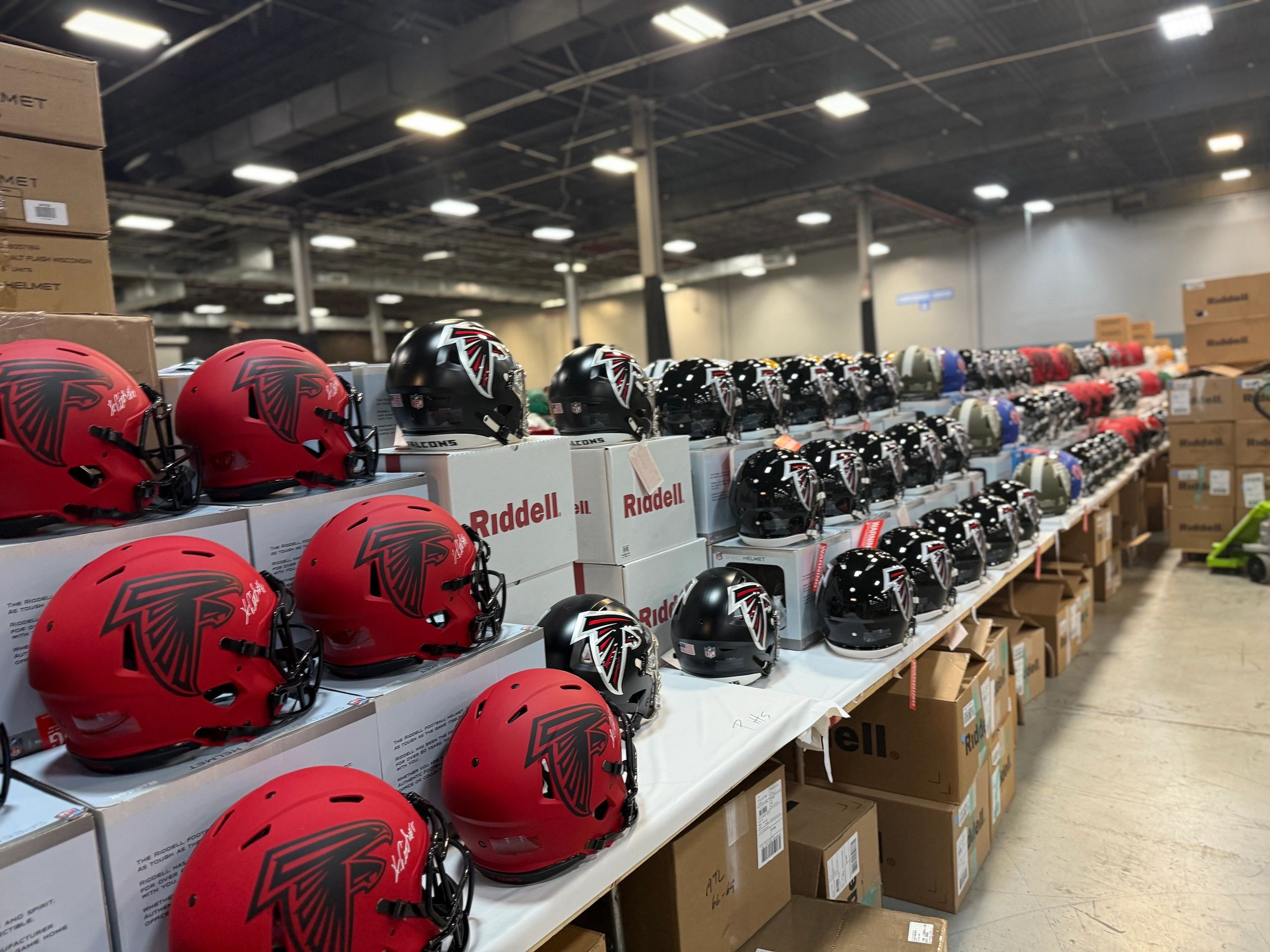 Rows of helmets at a private signing