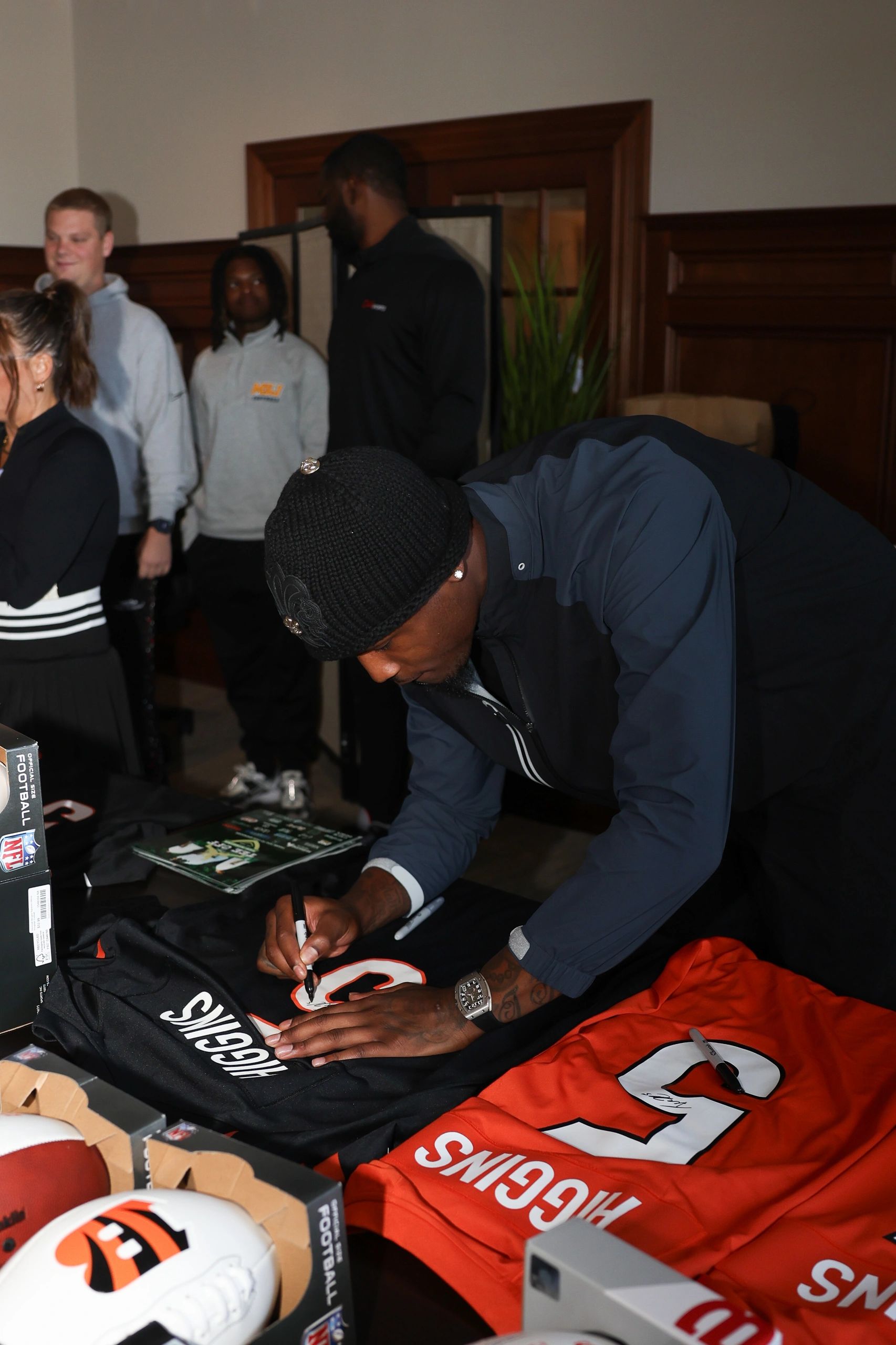 Signing Higgins jerseys